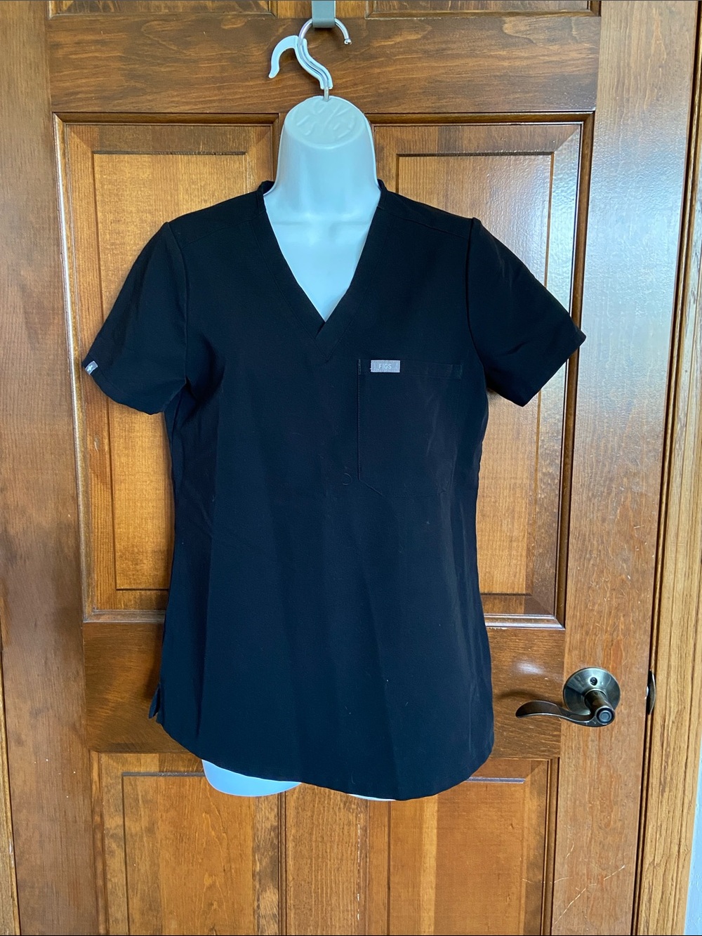 FIGS Technical Collection Casma Three-Pocket Scrub Top color Black Size XS